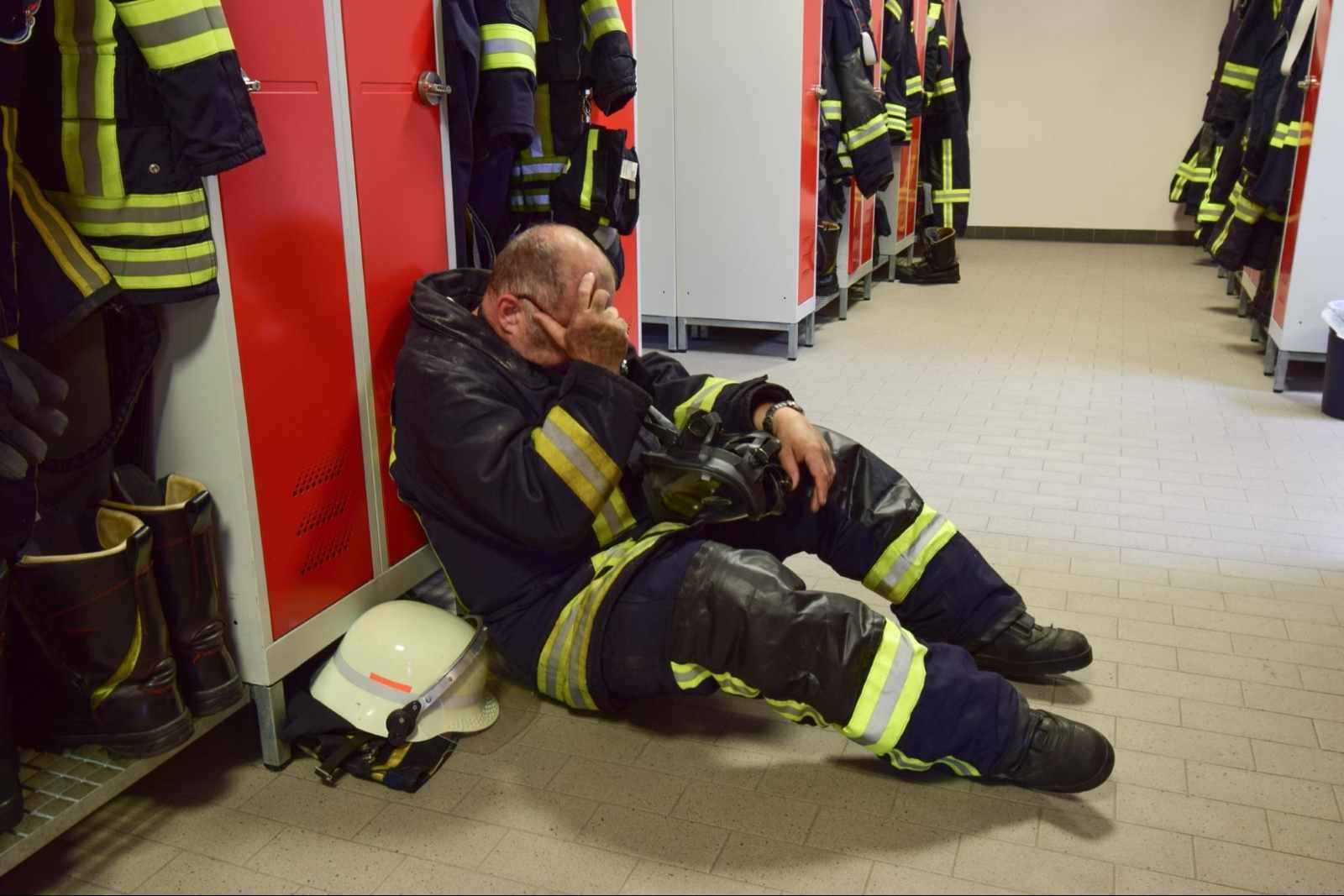 how to rehydrate: Fireman sitting on the floor of a locker room