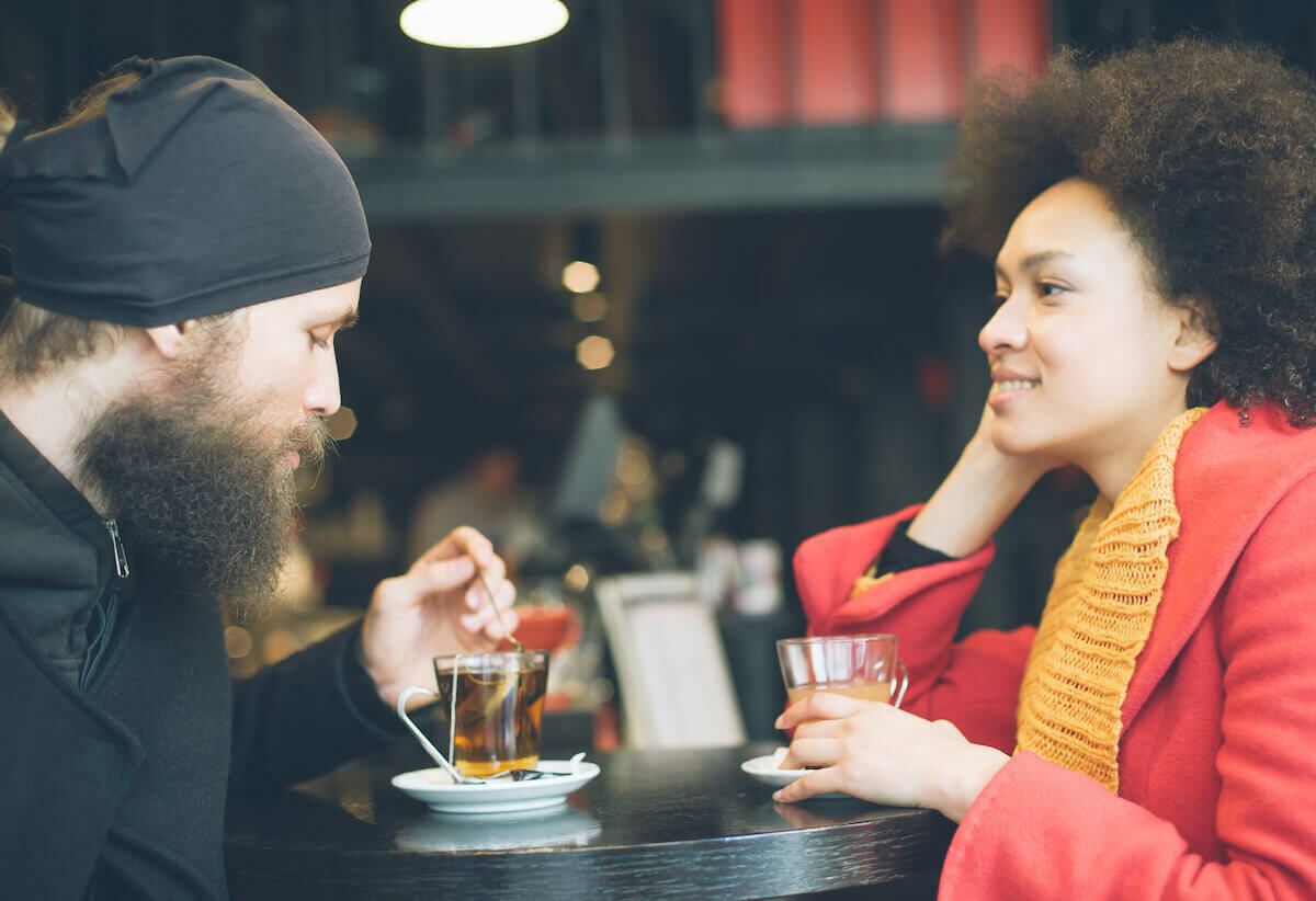 Couple drinking tea at an outdoor cafe