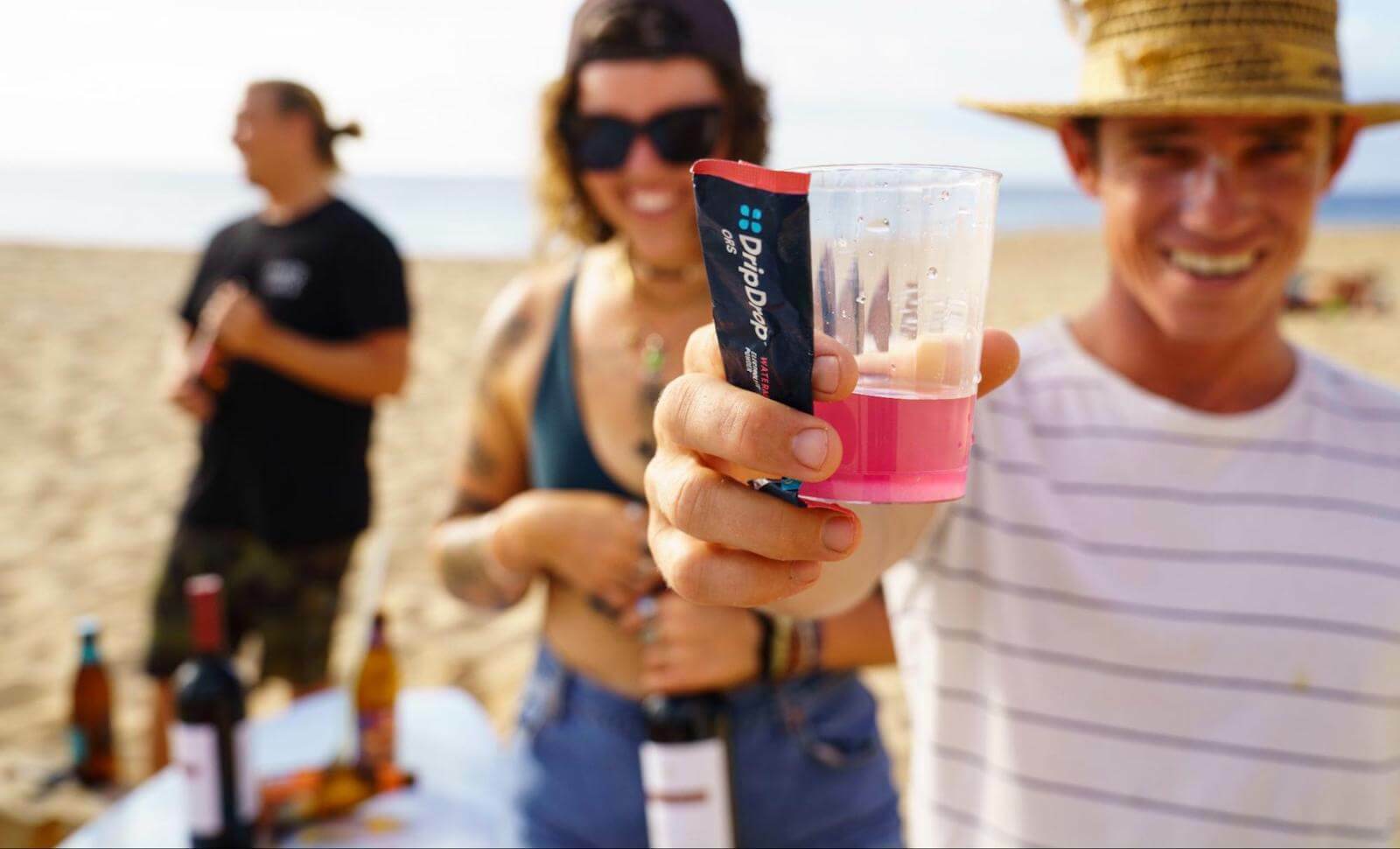 How to cool down: People at the beach with a glass of DripDrop ORS