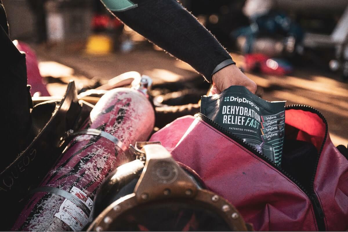 Drip Drop vs Gatorade: person getting some DripDrop ORS from their bag