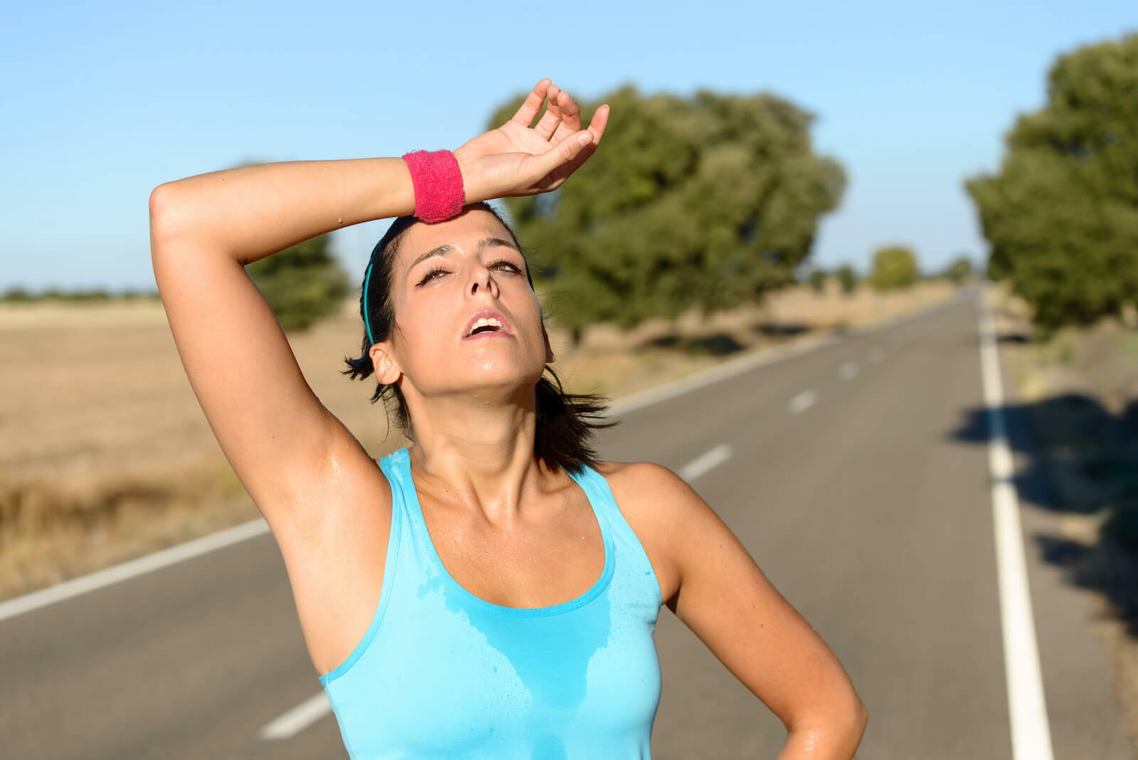 How to cool down: Tired woman sweating from running